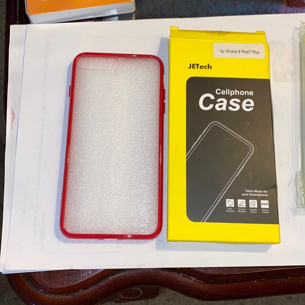 A iphone 7or8 plus case that has a red boarder and a clear backing.